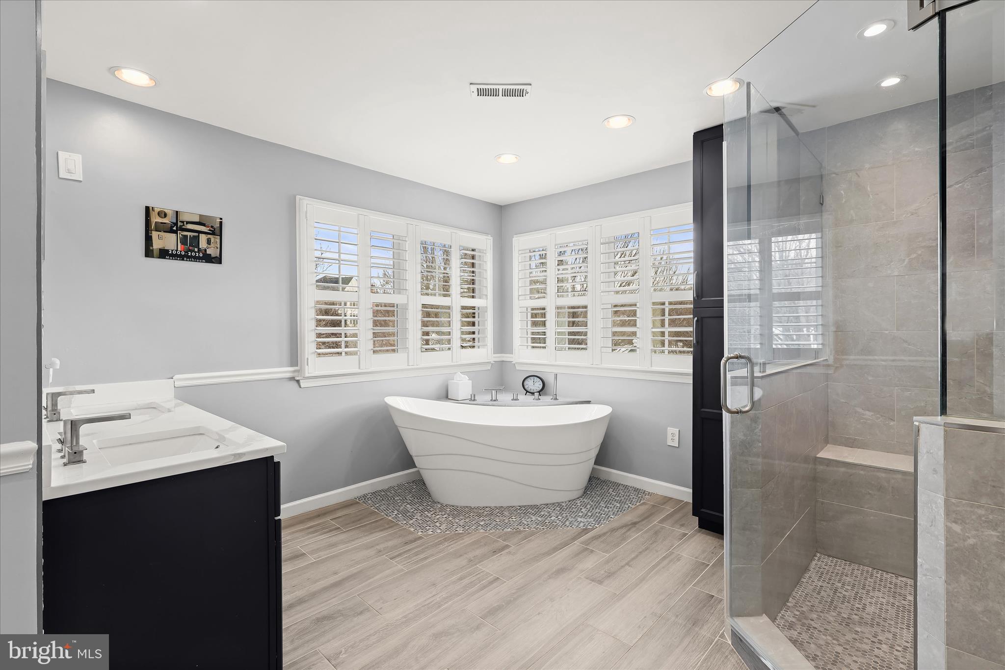 8061 Hunterbrooke Lane Fulton, MD 20759 - Photo 42 of 90 a bathroom with a bathtub sink and shower