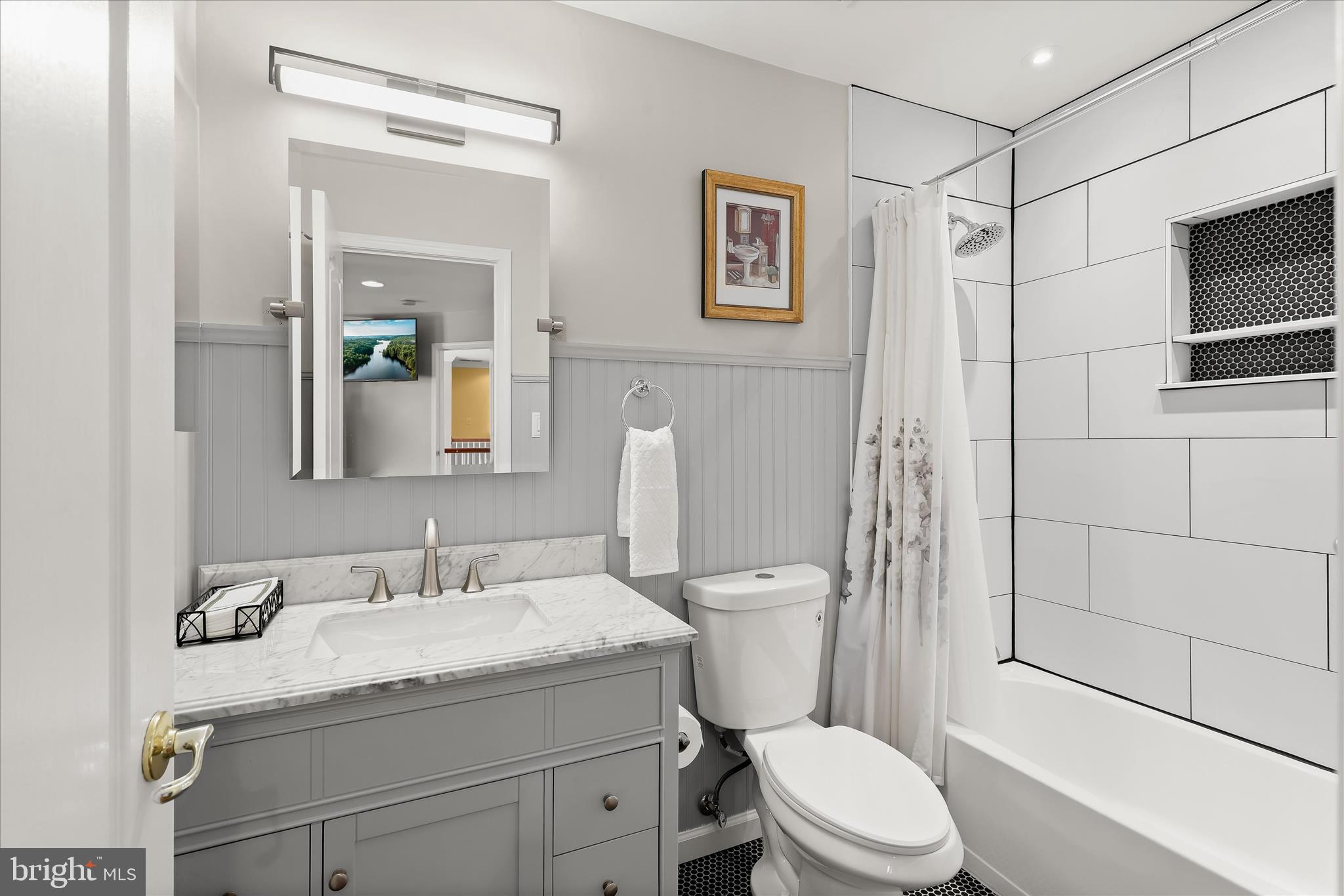 8061 Hunterbrooke Lane Fulton, MD 20759 - Photo 47 of 77 a bathroom with a granite countertop sink toilet and shower