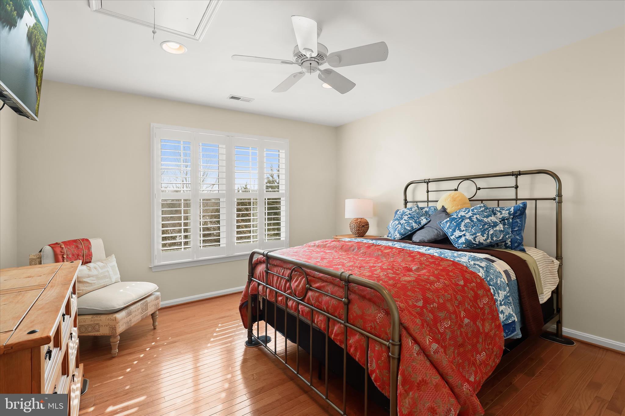 8061 Hunterbrooke Lane Fulton, MD 20759 - Photo 48 of 77 a bedroom with a bed and wooden floor