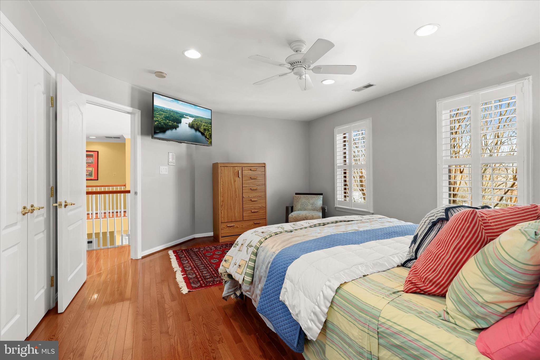 8061 Hunterbrooke Lane Fulton, MD 20759 - Photo 49 of 90 a spacious bedroom with a bed and wooden floor