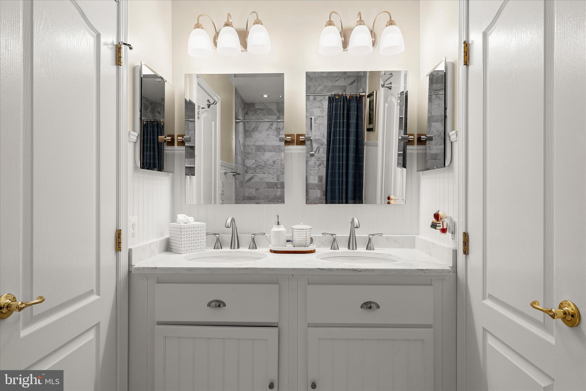 8061 Hunterbrooke Lane Fulton, MD 20759 - Photo 50 of 77 a bathroom with a double vanity sink and mirror