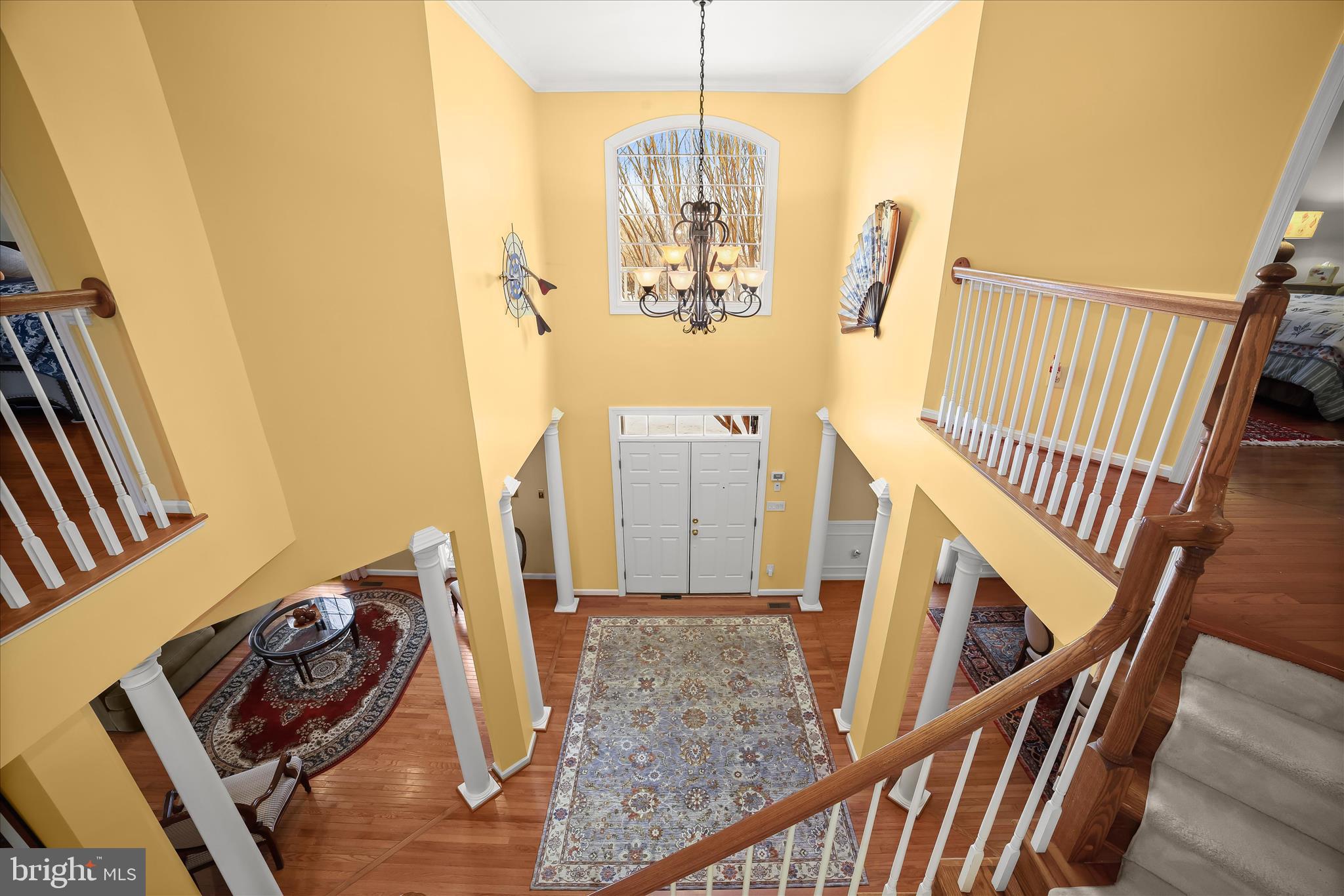 8061 Hunterbrooke Lane Fulton, MD 20759 - Photo 5 of 77 a view of a livingroom with furniture stairs wooden floor and windows