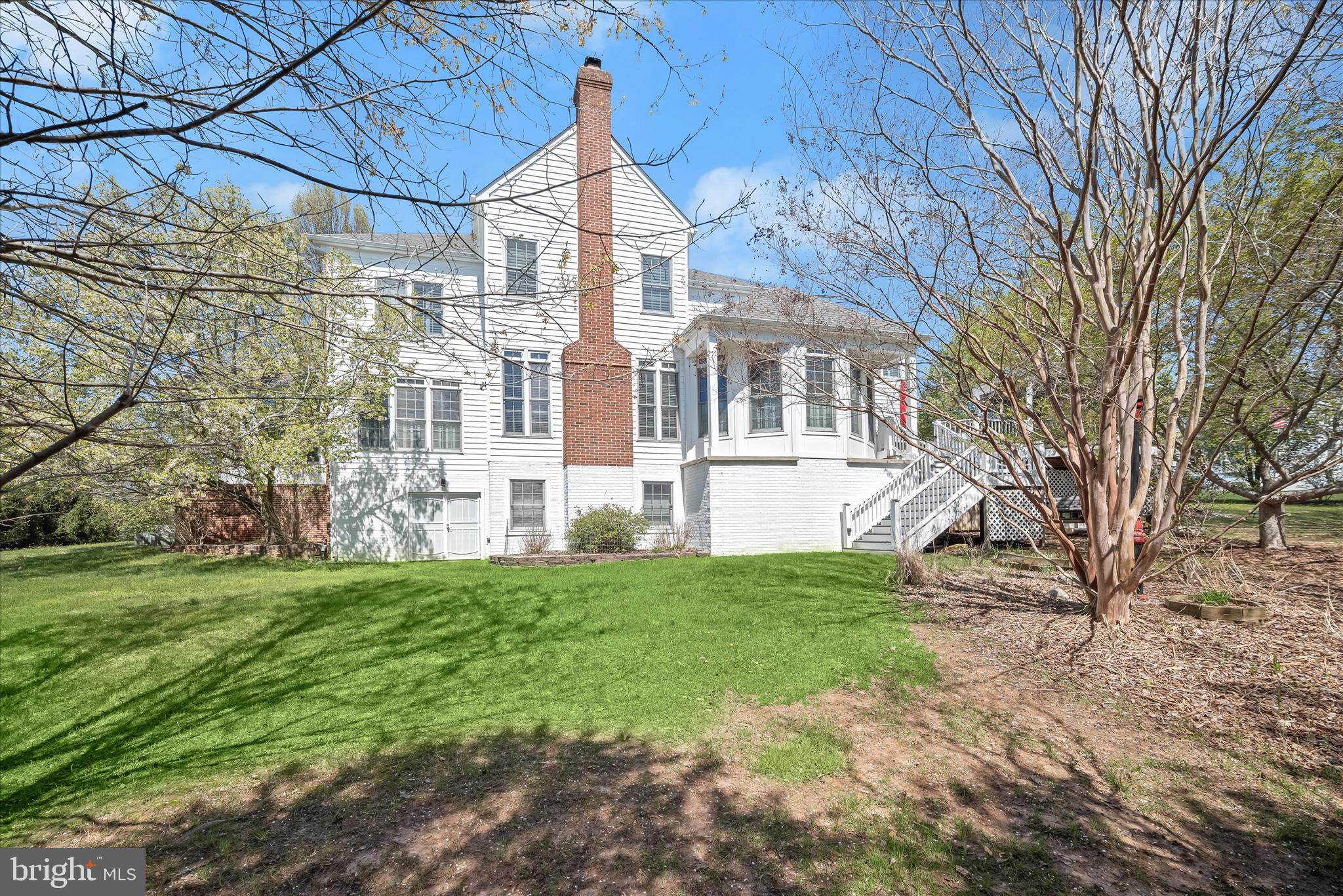 8061 Hunterbrooke Lane Fulton, MD 20759 - Photo 67 of 77 a front view of a house with a garden
