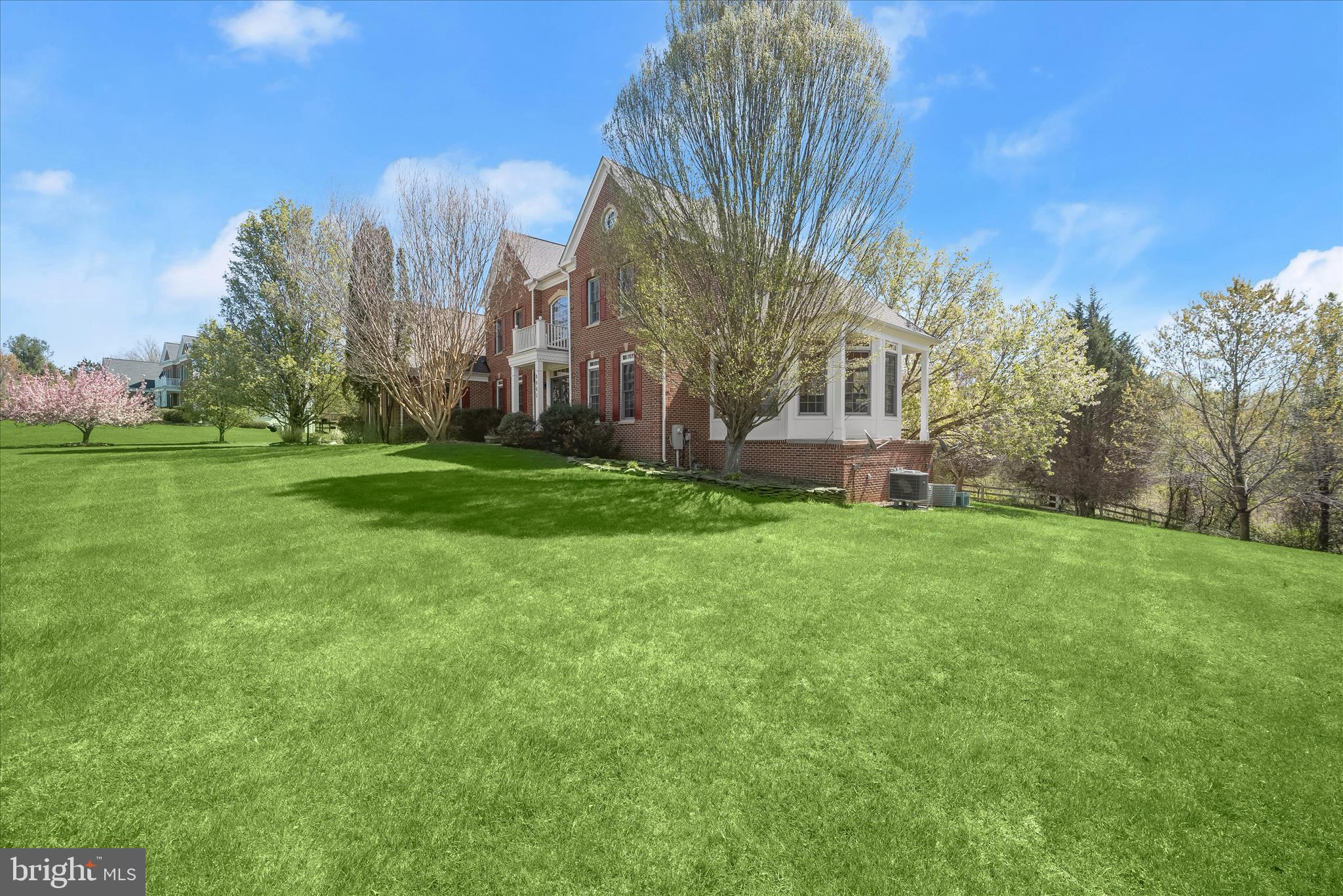 8061 Hunterbrooke Lane Fulton, MD 20759 - Photo 82 of 90 a view of a building in front of a big yard with large trees