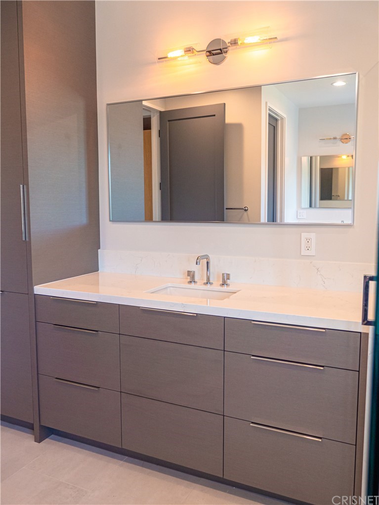 8184 Mannix Drive Los Angeles, CA 90046 - Photo 24 of 53 a bathroom with a sink and a mirror