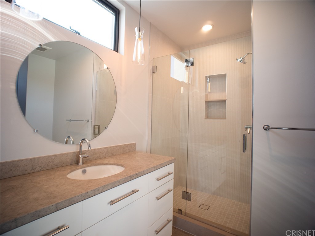 8184 Mannix Drive Los Angeles, CA 90046 - Photo 26 of 53 a bathroom with a sink a toilet and shower