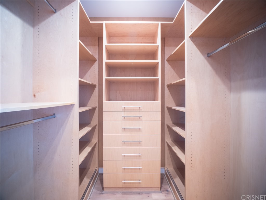 8184 Mannix Drive Los Angeles, CA 90046 - Photo 27 of 53 a view of walk in closet with empty racks
