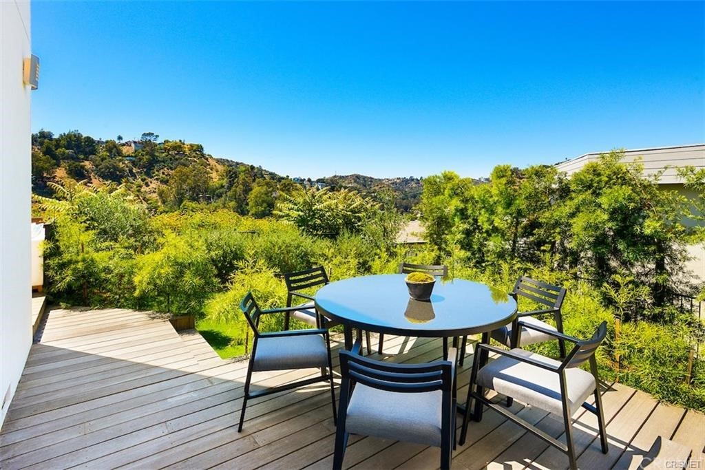 8184 Mannix Drive Los Angeles, CA 90046 - Photo 4 of 53 a balcony with table and chairs