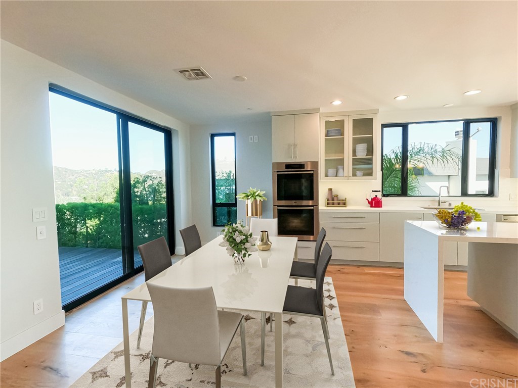 8184 Mannix Drive Los Angeles, CA 90046 - Photo 34 of 53 a view of a dining room with furniture window and outside view