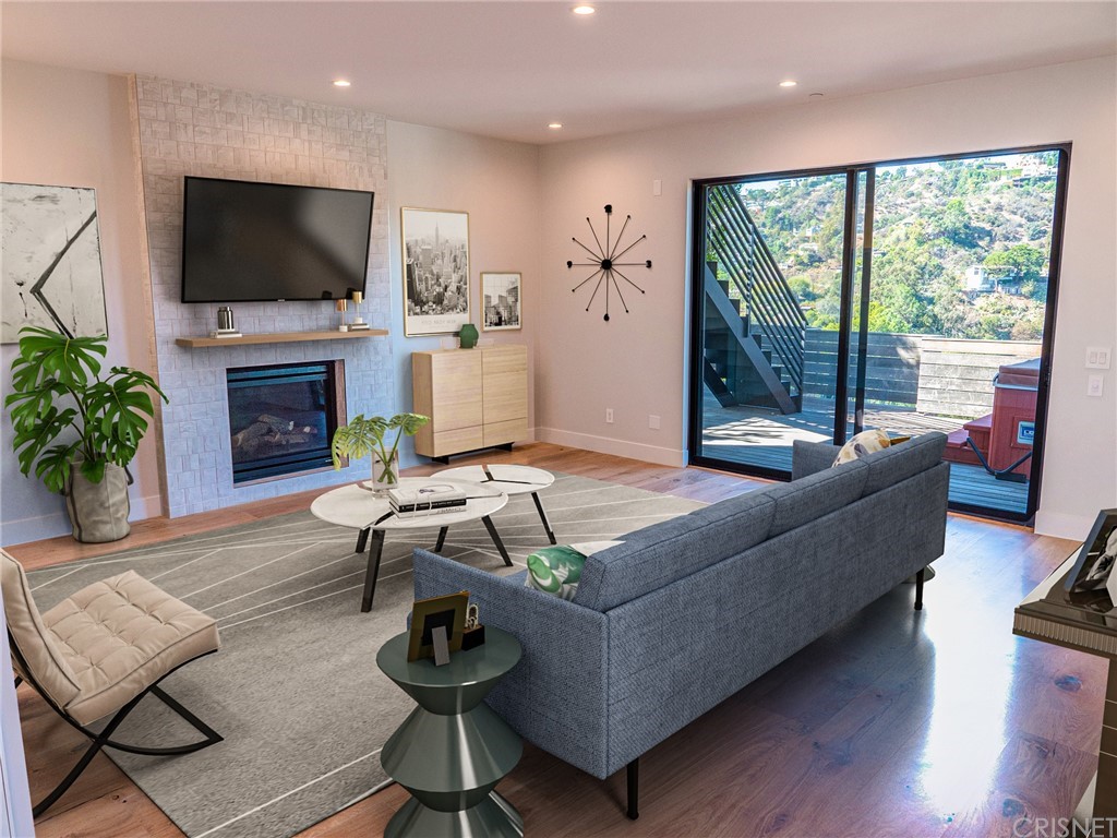 8184 Mannix Drive Los Angeles, CA 90046 - Photo 35 of 53 a living room with furniture a flat screen tv and a fireplace