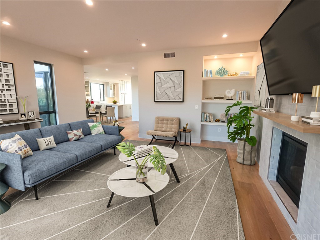 8184 Mannix Drive Los Angeles, CA 90046 - Photo 37 of 53 a living room with furniture a flat screen tv and a fireplace