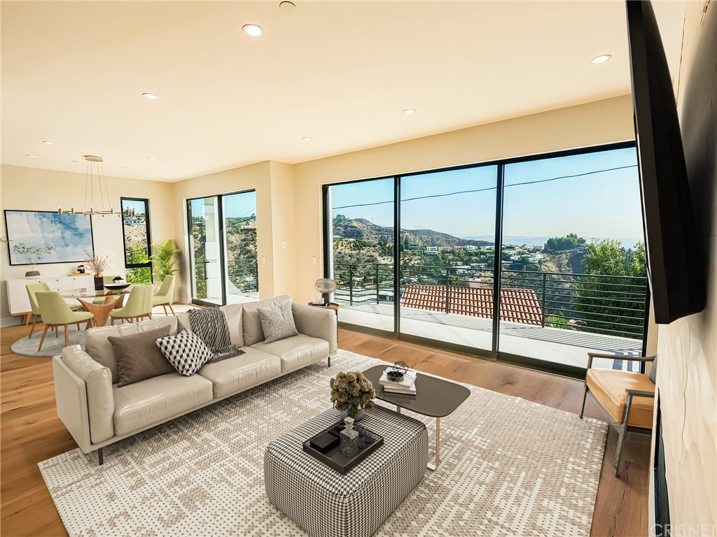 8184 Mannix Drive Los Angeles, CA 90046 - Photo 40 of 53 a living room with furniture and a large window