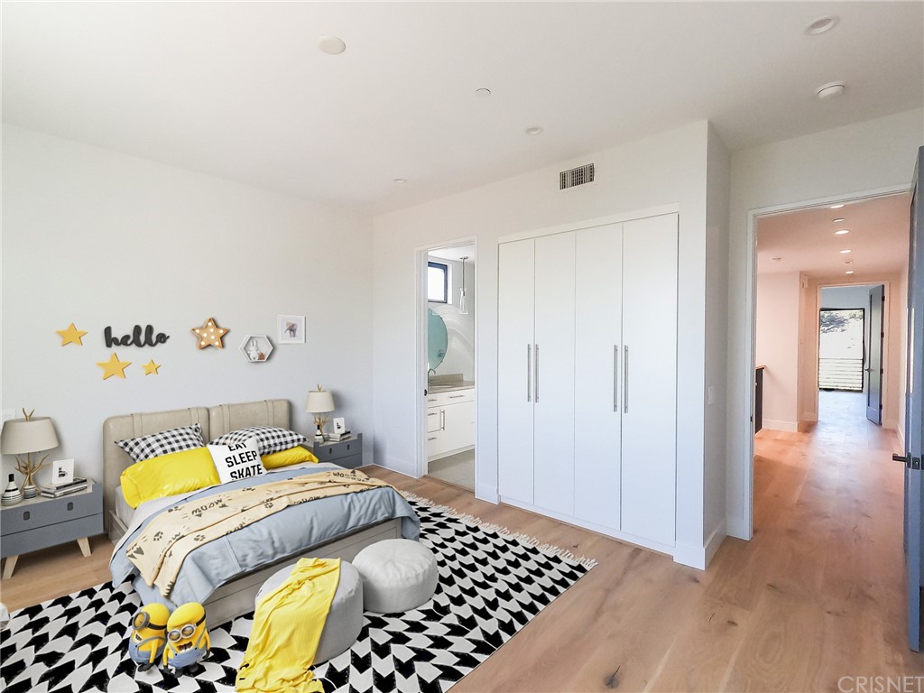 8184 Mannix Drive Los Angeles, CA 90046 - Photo 49 of 53 a bedroom with a bed and wooden floor