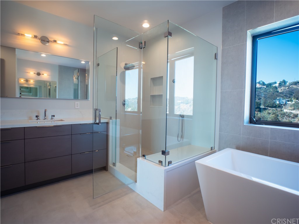 8184 Mannix Drive Los Angeles, CA 90046 - Photo 52 of 53 a bathroom with a tub a sink shower double vanity