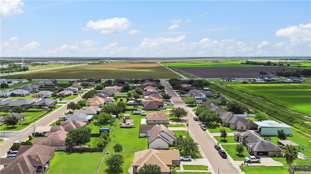 402 Mockingbird Lane Edcouch, TX 78538 - Photo 25 of 25 Residential neighborhood featuring single-story homes, mature landscaping, paved streets, and expansive surrounding green spaces