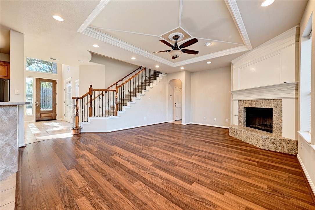 8408 Big Timber Drive Austin, TX 78735 - Photo 1 of 1 a view of an empty room with wooden floor fireplace and a window