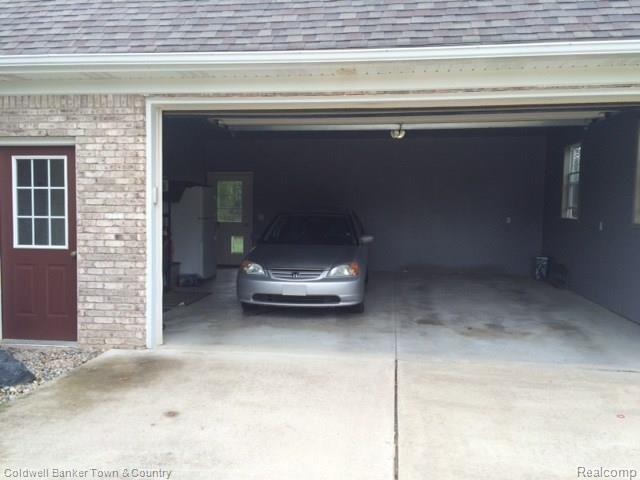 4770 Golf Club Road Howell, MI 48843 - Photo 16 of 59 Finished Attached Garage