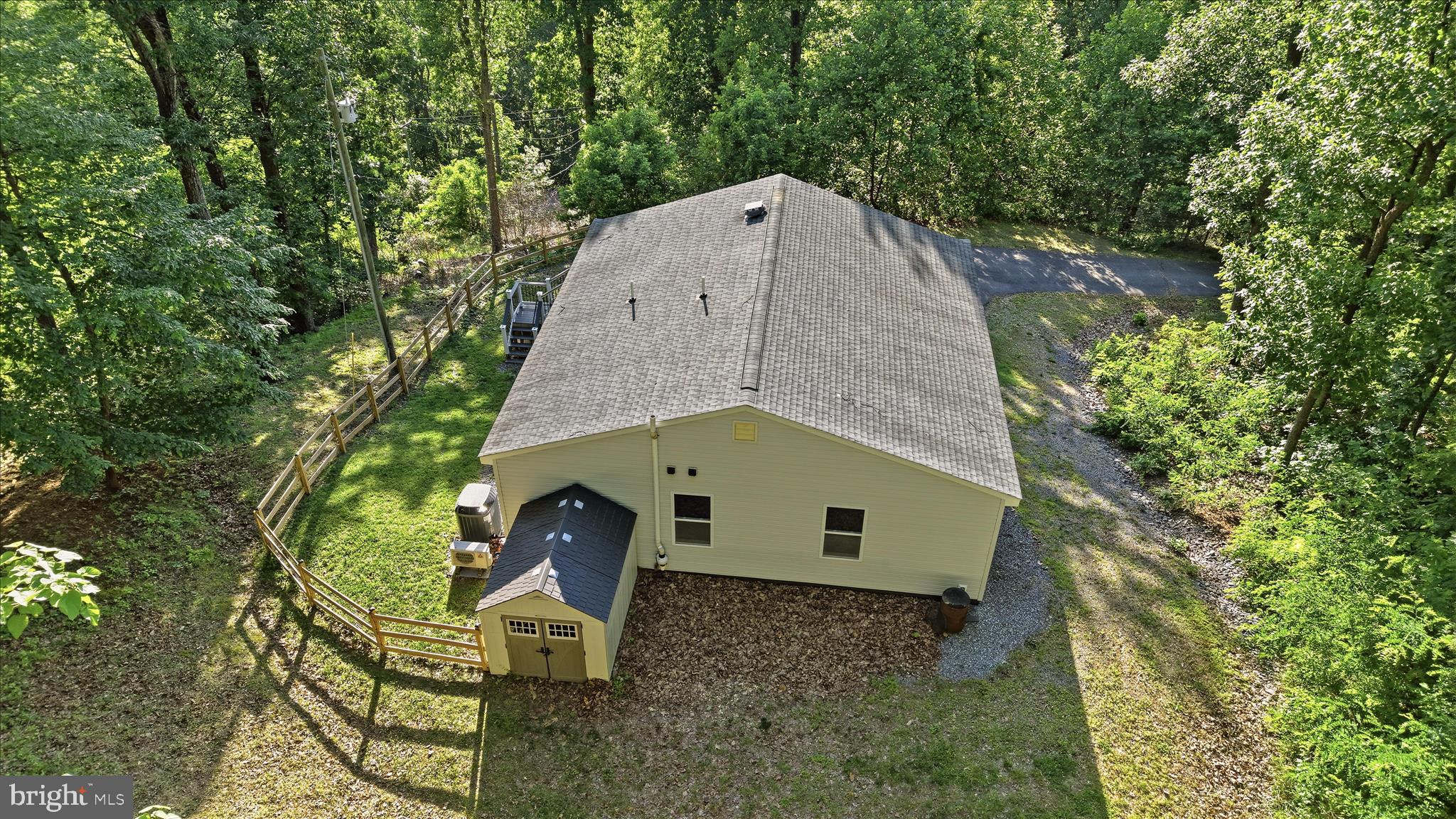 500 Delicious Road Linden, VA 22642 - Photo 57 of 80 a aerial view of a house with a yard and large trees