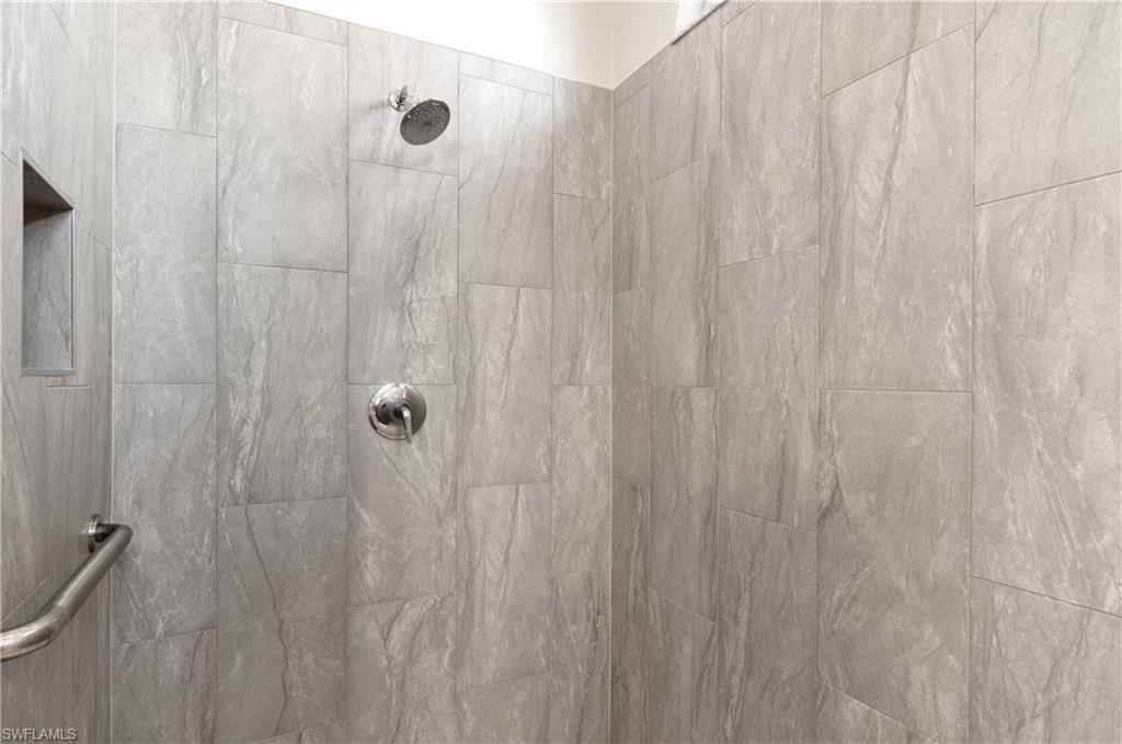 20991 Rivers Ford Estero, FL 33928 - Photo 14 of 32 a bathroom with a shower curtain