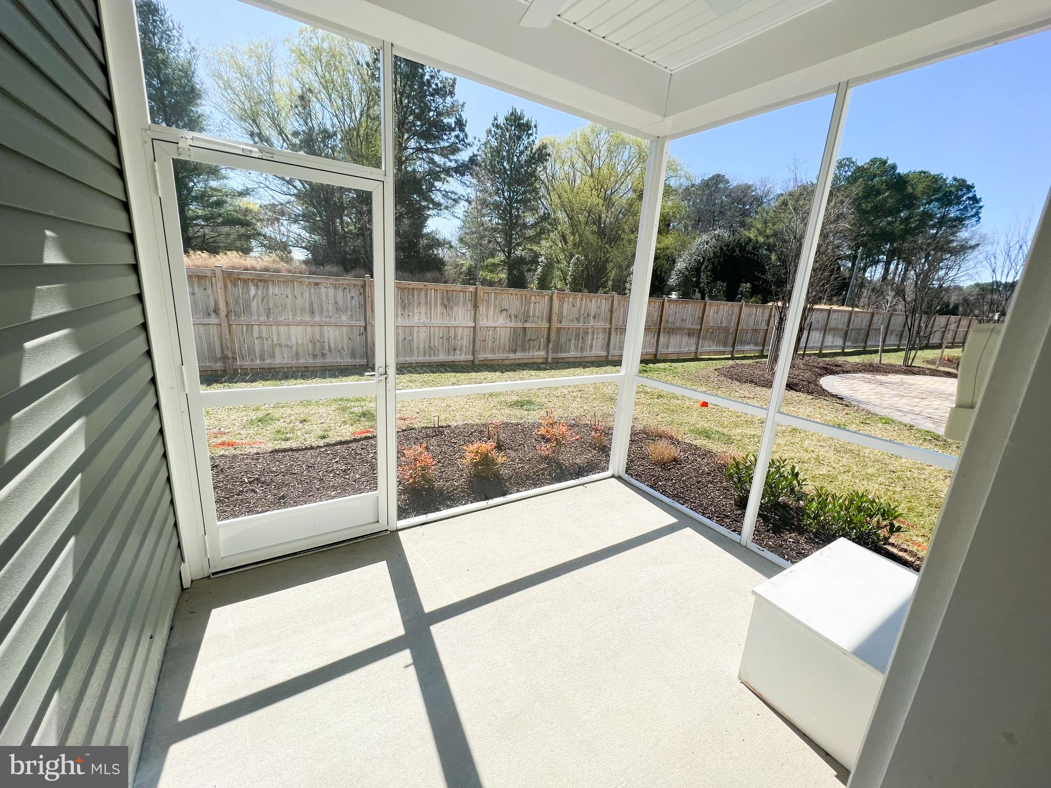 1015 Champlain Court Trappe, MD 21673 - Photo 14 of 38 a view of a glass door with a tv from a window