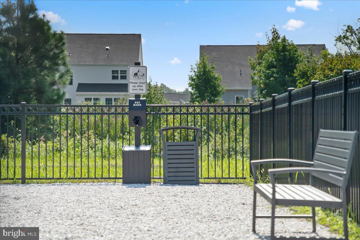 1015 Champlain Court Trappe, MD 21673 - Photo 35 of 38 a view of a chair and tables in the backyard