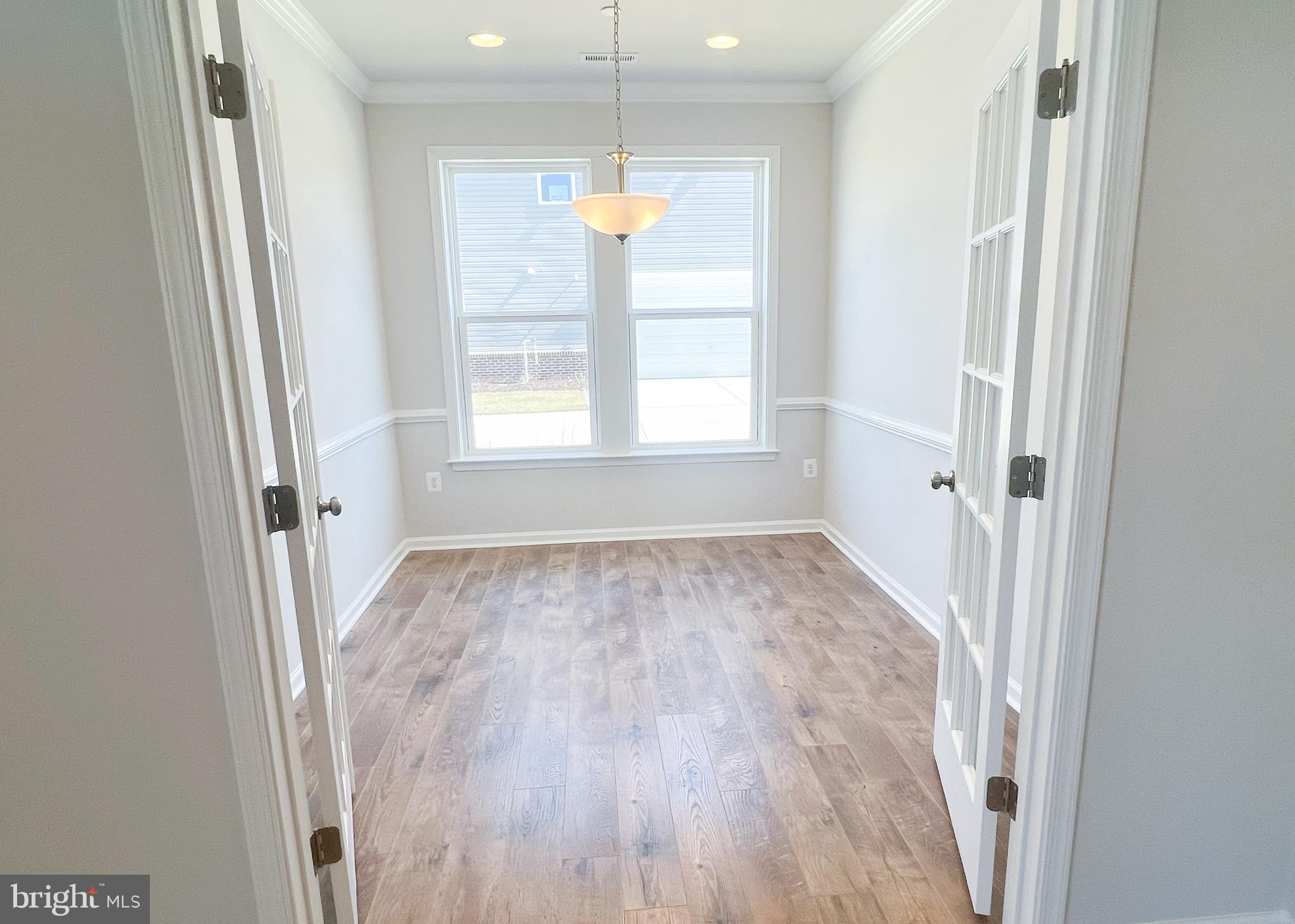 1015 Champlain Court Trappe, MD 21673 - Photo 8 of 38 a view of an empty room with a window