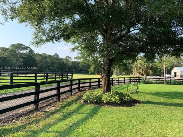 a view of a backyard with a fountain