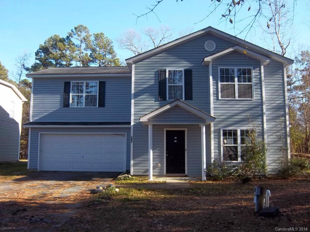 814 Mt Holly-Huntersville Road Charlotte, NC 28214 - Photo 1 of 13 a front view of a house with a yard and garage