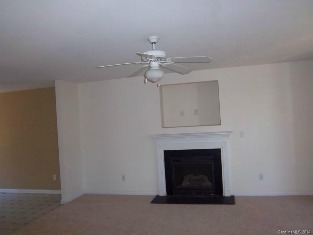 814 Mt Holly-Huntersville Road Charlotte, NC 28214 - Photo 2 of 13 a living room with a fireplace