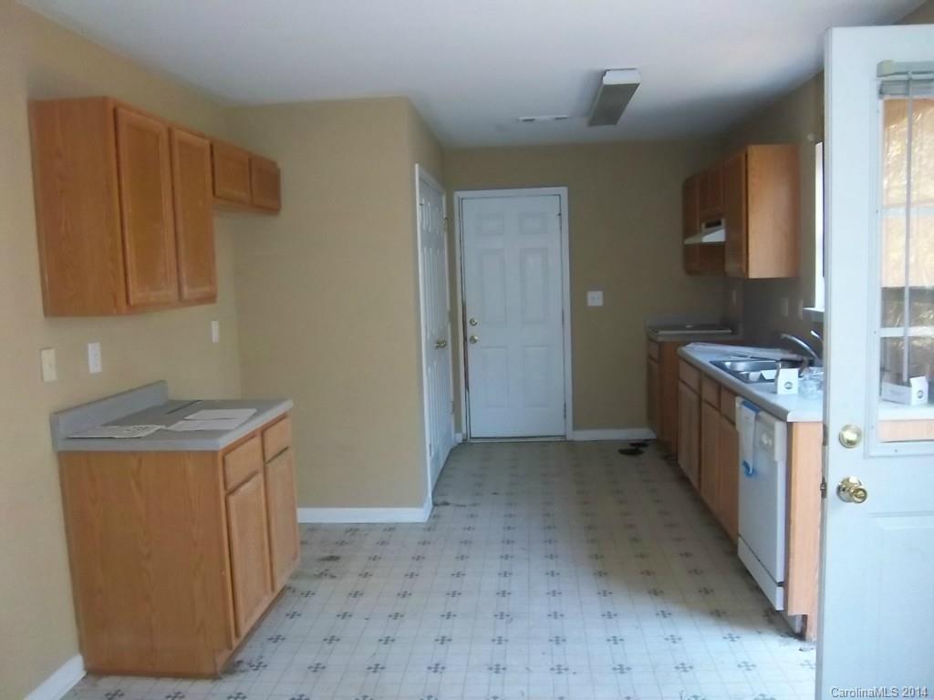 814 Mt Holly-Huntersville Road Charlotte, NC 28214 - Photo 3 of 13 a view of a kitchen with cabinets