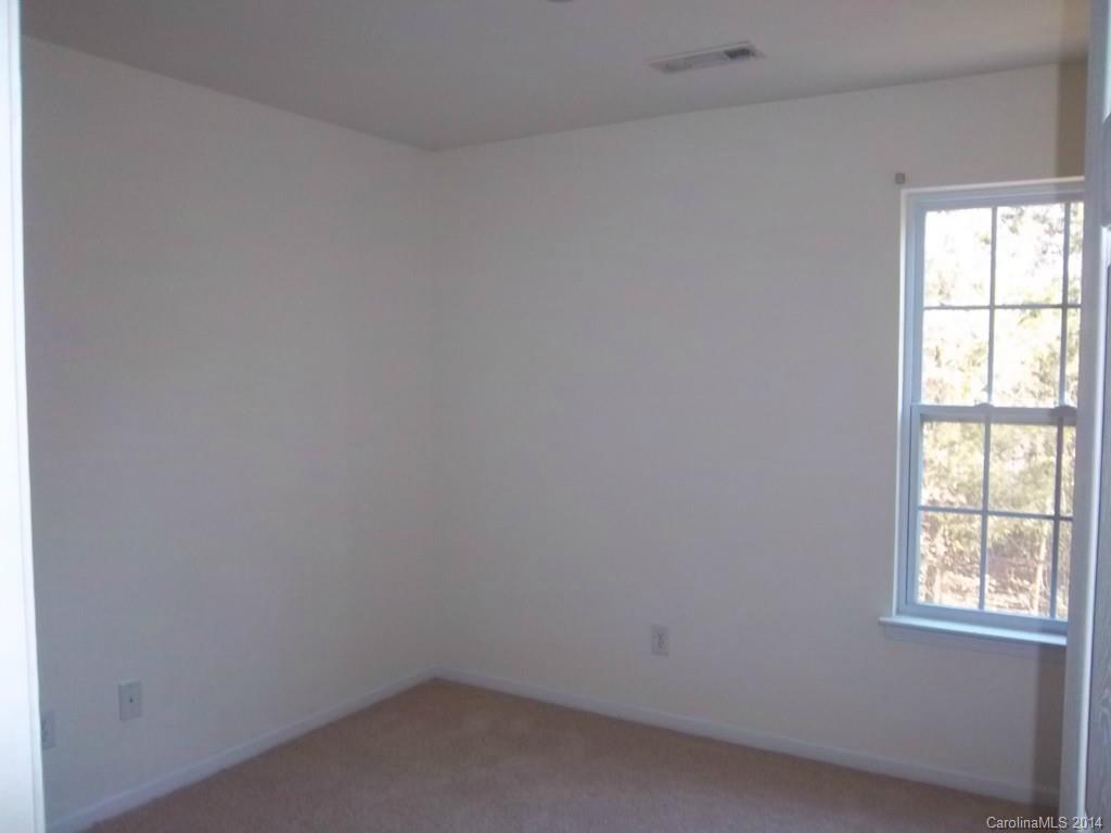 814 Mt Holly-Huntersville Road Charlotte, NC 28214 - Photo 6 of 13 an empty room with a window