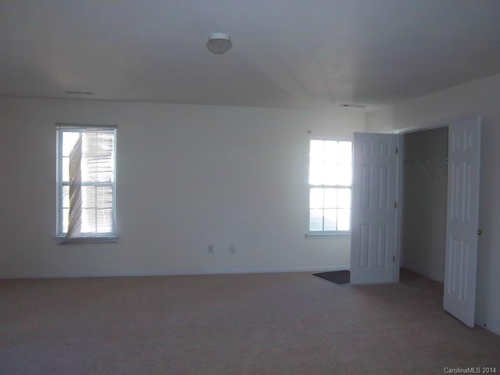 814 Mt Holly-Huntersville Road Charlotte, NC 28214 - Photo 9 of 13 an empty room with a window