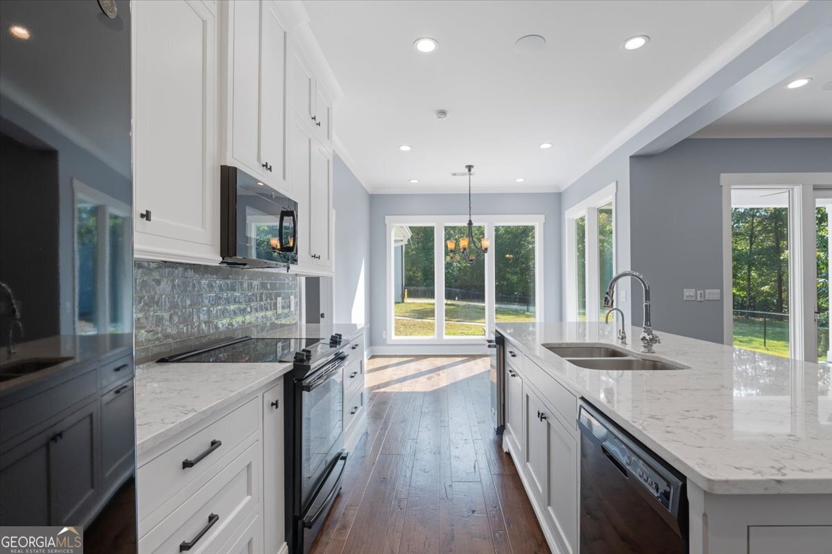 1750 Reids Ferry Road Buckhead, GA 30625 - Photo 12 of 57 a kitchen with granite countertop kitchen island a sink appliances and cabinets