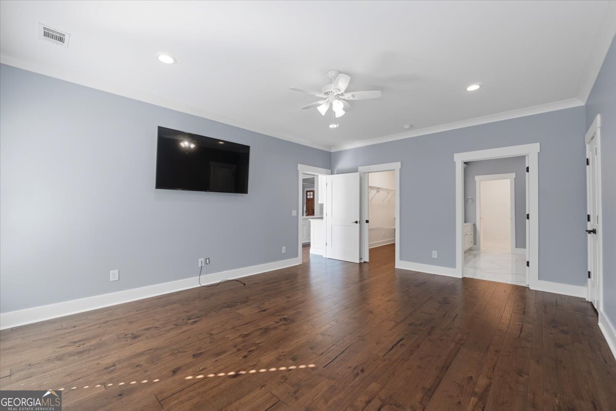 1750 Reids Ferry Road Buckhead, GA 30625 - Photo 20 of 57 a view of a livingroom with wooden floor and a ceiling fan