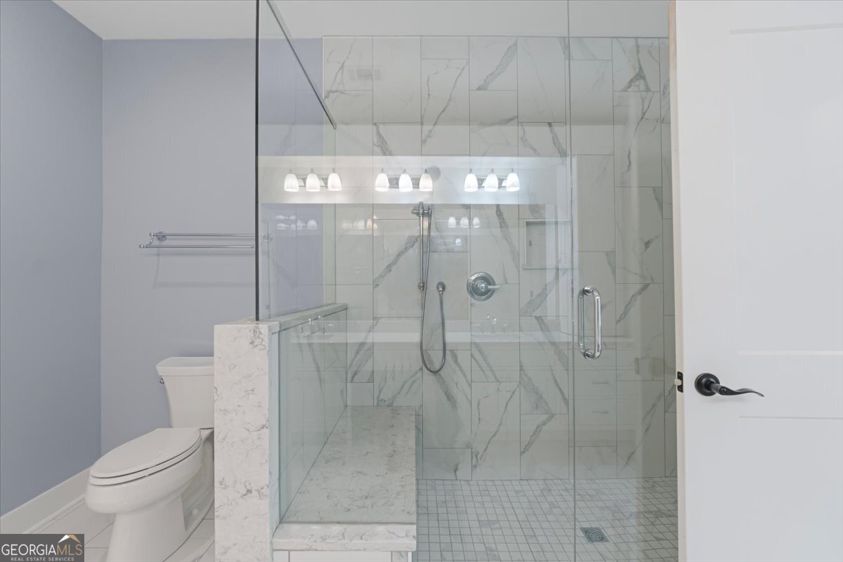 1750 Reids Ferry Road Buckhead, GA 30625 - Photo 23 of 57 a bathroom with a shower a toilet and sink