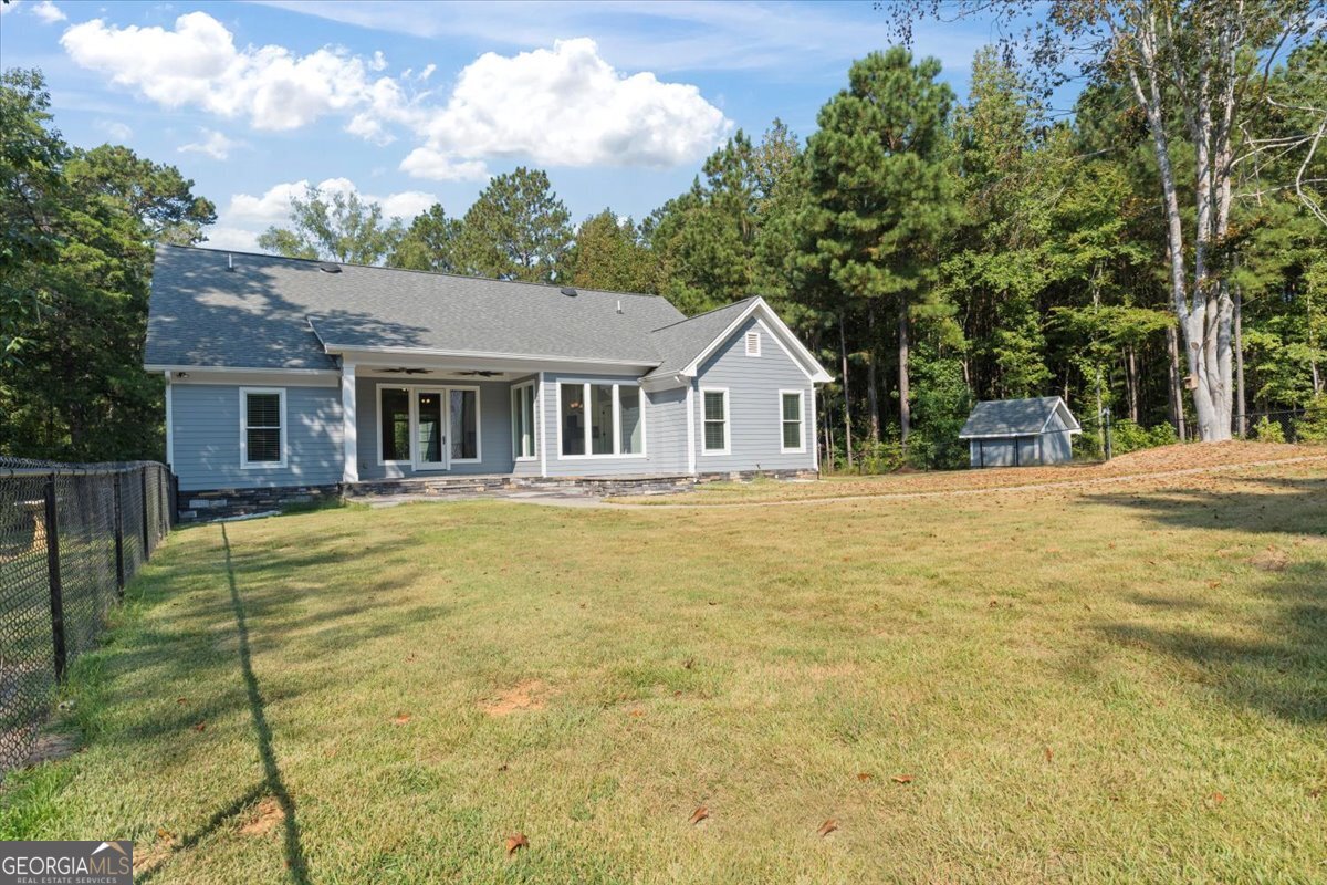 1750 Reids Ferry Road Buckhead, GA 30625 - Photo 30 of 57 a house view with swimming pool in front of it