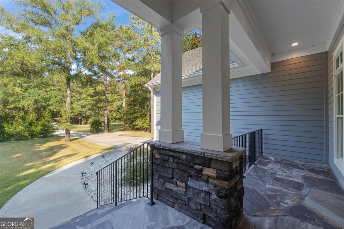 1750 Reids Ferry Road Buckhead, GA 30625 - Photo 41 of 57 a view of a patio with table and chairs and wooden fence