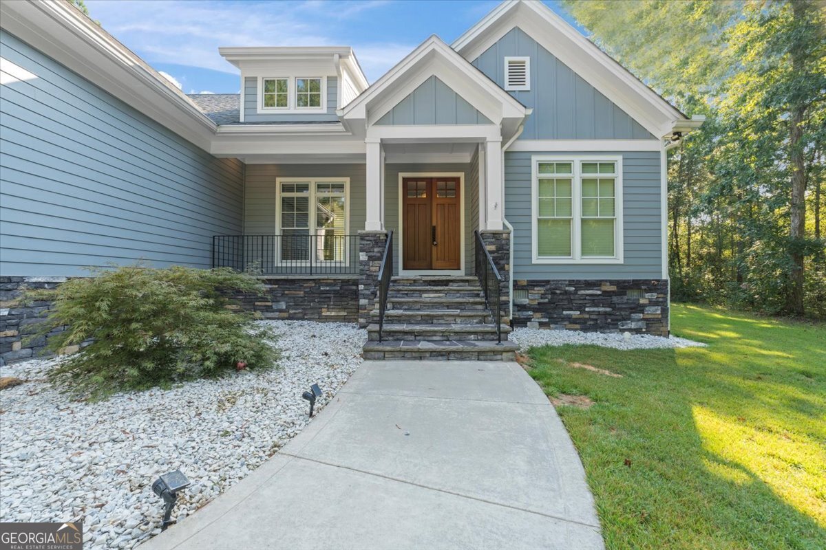 1750 Reids Ferry Road Buckhead, GA 30625 - Photo 43 of 57 a front view of a house with garden