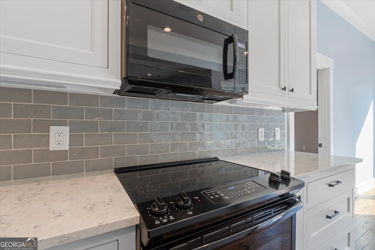 1750 Reids Ferry Road Buckhead, GA 30625 - Photo 10 of 57 a kitchen with microwave stove and cabinets