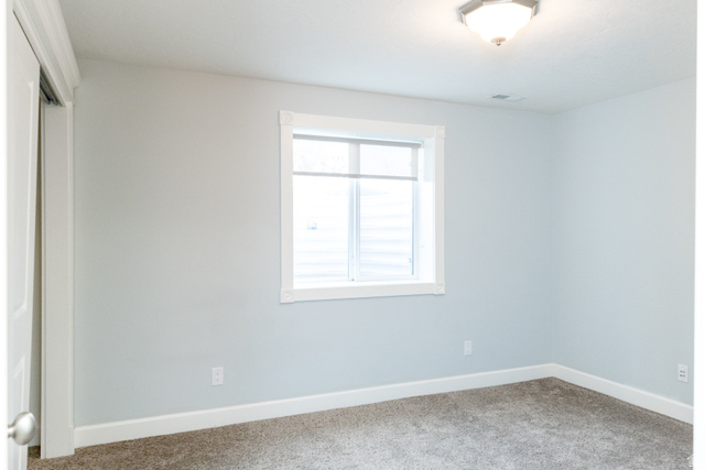 434 Cardon Ridge Drive Smithfield, UT 84335 - Photo 44 of 59 Unfurnished bedroom featuring a closet and carpet floors