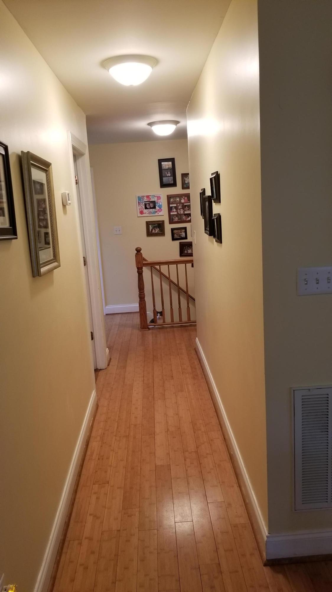 181 Silver Shadow Road Hardy, VA 24101 - Photo 18 of 47 a view of a hallway with wooden floor