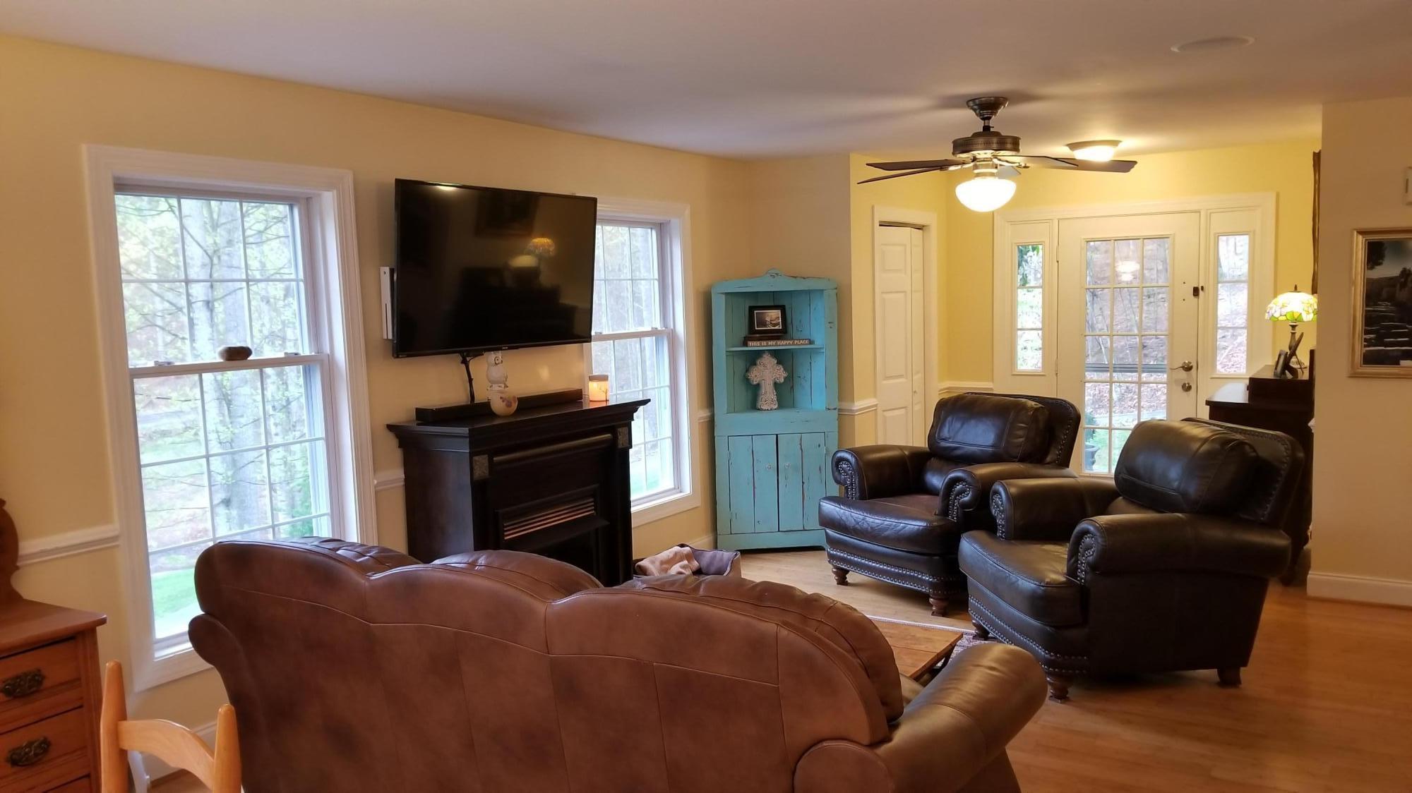 181 Silver Shadow Road Hardy, VA 24101 - Photo 4 of 47 a living room with furniture and a flat screen tv