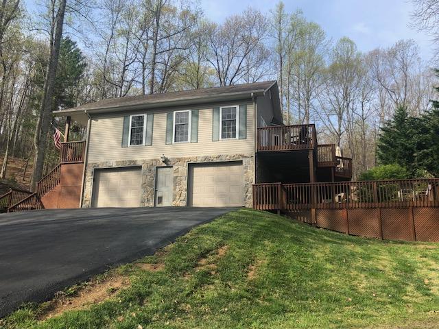 181 Silver Shadow Road Hardy, VA 24101 - Photo 33 of 47 a front view of a house with a yard