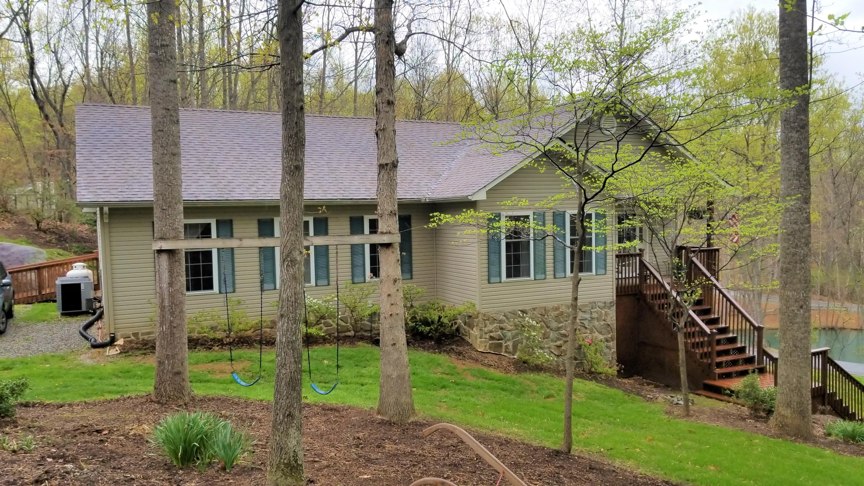 181 Silver Shadow Road Hardy, VA 24101 - Photo 46 of 47 a front view of a house with a garden and plants