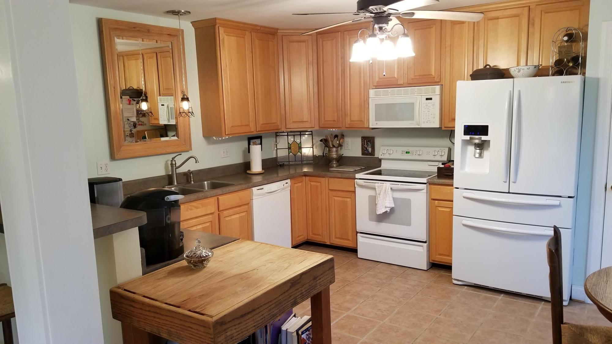 181 Silver Shadow Road Hardy, VA 24101 - Photo 7 of 47 a kitchen with a stove a sink and a refrigerator