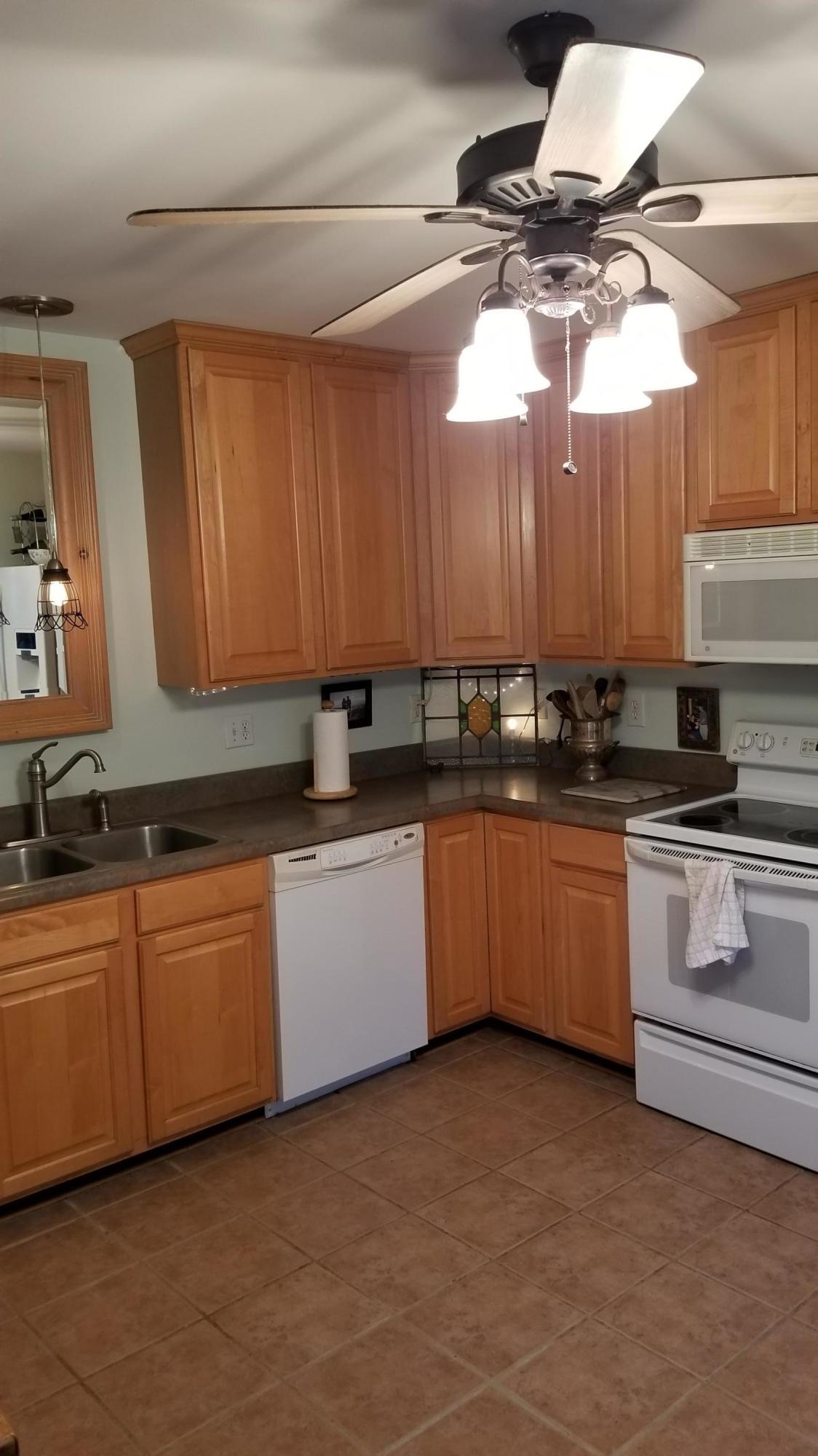 181 Silver Shadow Road Hardy, VA 24101 - Photo 8 of 47 a kitchen with granite countertop a sink cabinets and stainless steel appliances