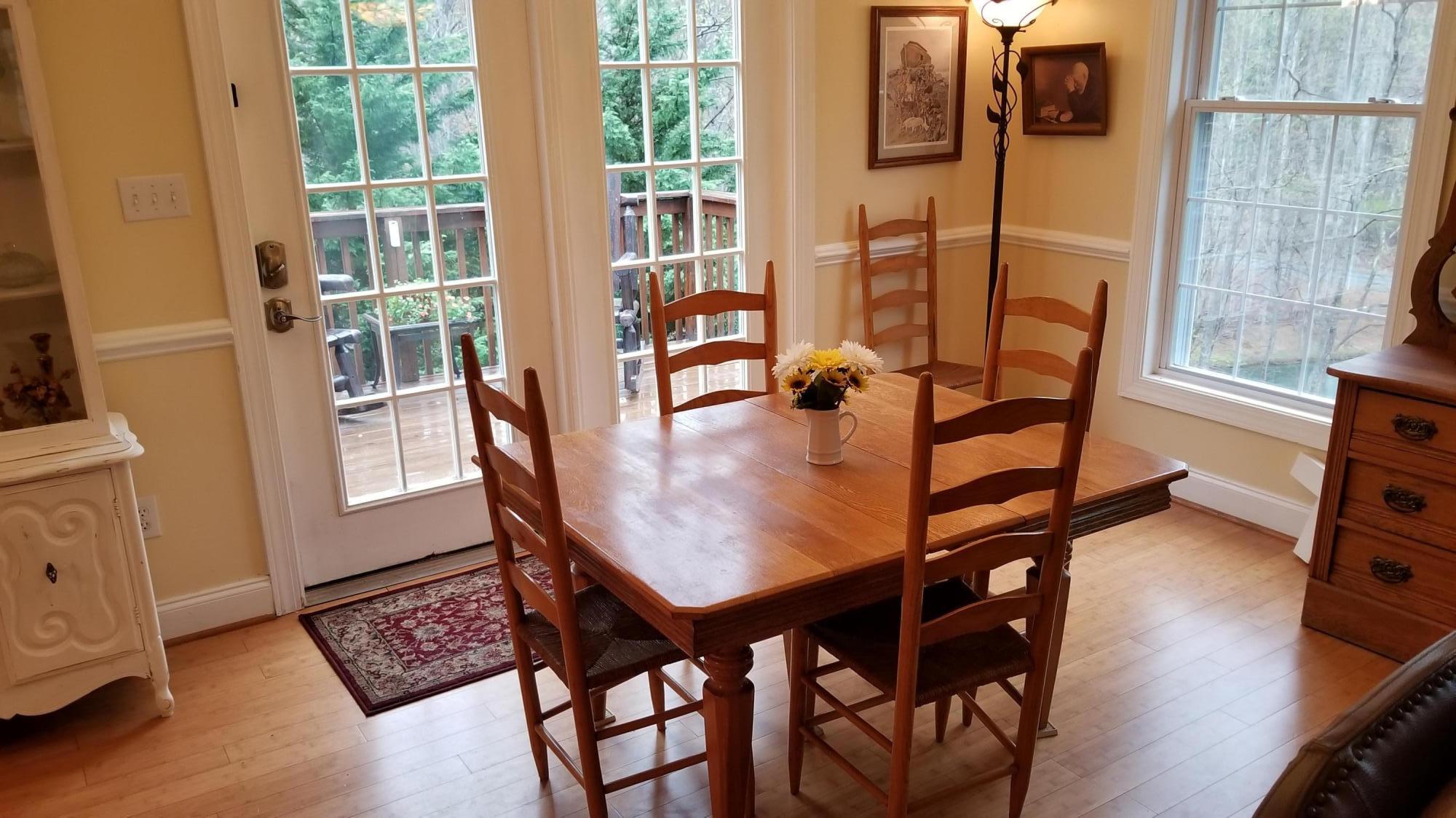 181 Silver Shadow Road Hardy, VA 24101 - Photo 10 of 47 a dining room with furniture and wooden floor