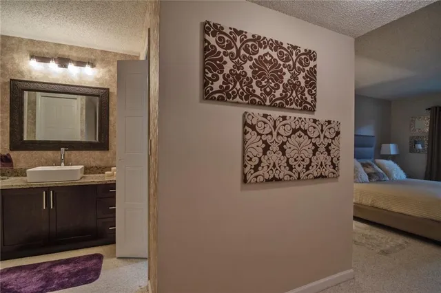 a en suite bathroom with a sink and a mirror