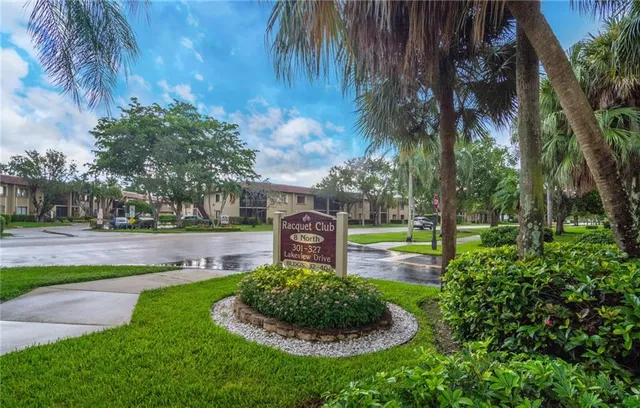 a swimming pool with outdoor seating and yard