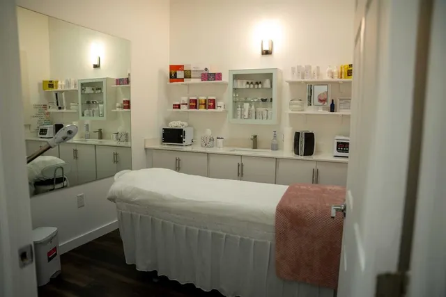 a room with a bed and a bookshelf